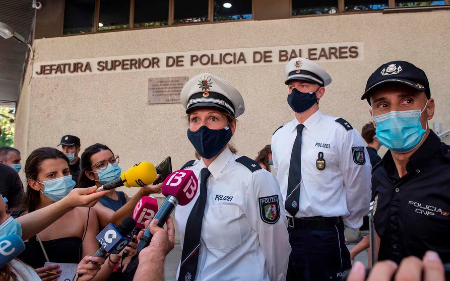 German police officers Maden Baier (L) and Mike Geldermann (C) talk to the press at the National Police headquarters in Palma de Mallorca, Spain, 20 August 2020. Baier and Geldermann have been cooperating with Spanish police during patrols in Palma de Mallorca, during the last three weeks, within a European Union initiative that has been welcomed by tourists visiting the island. EFE/ Atienza
